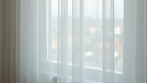 Delicate silk and sheer curtains in Melbourne being gently cleaned by professional curtain specialists